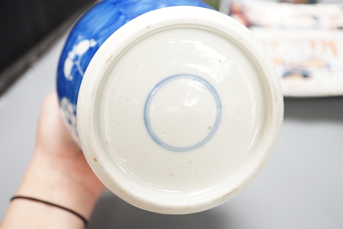 A 19th century Chinese blue and white 'prunus' vase, a Chinese green glazed jar, a japanese vase and two dishes and two Canton famille rose plates (7)